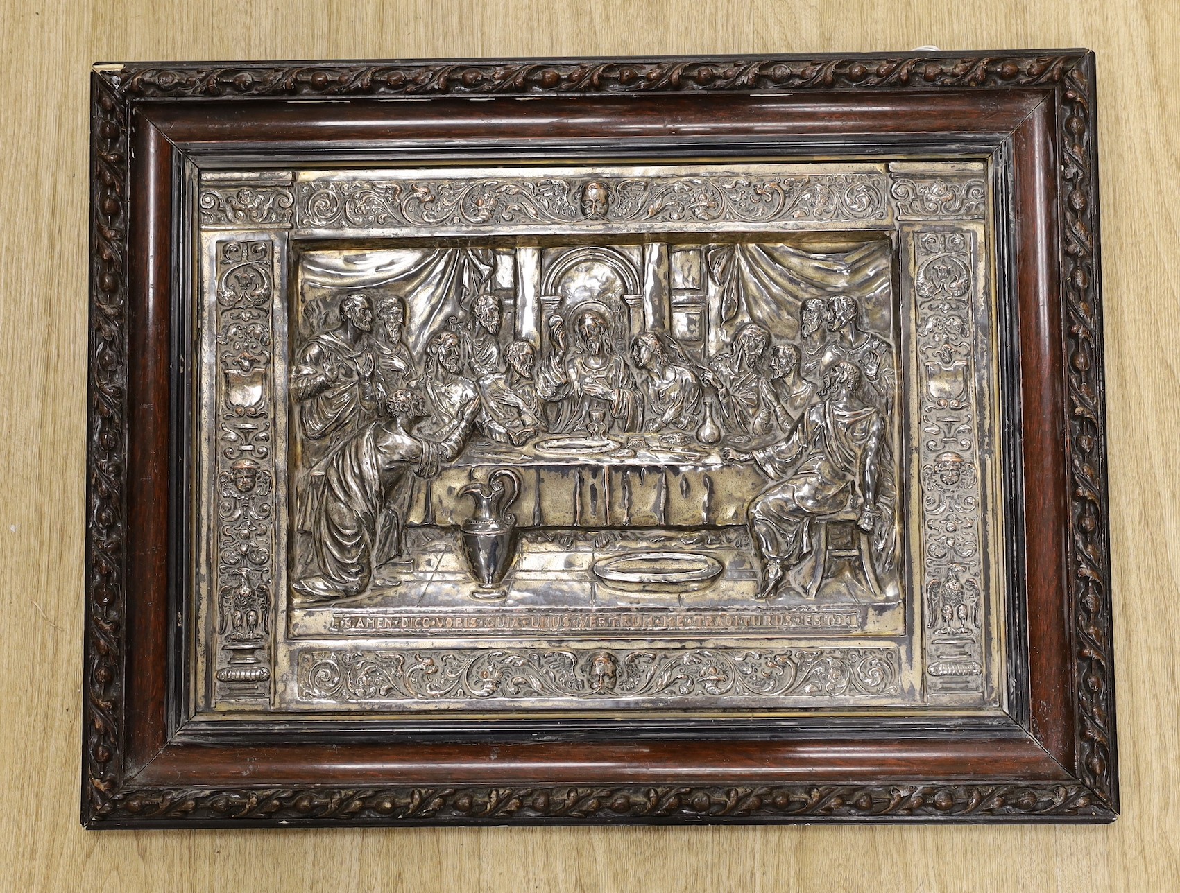 A framed embossed plaque, The Last Supper, silver plate on copper, 34.5 x 50cm excl frame